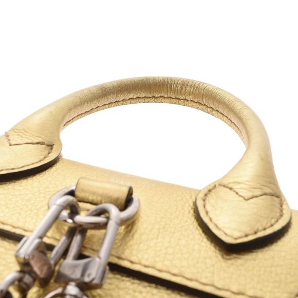 Louis Vuitton Lock Me Backpack Mini Gold Silver Leather Daypack - Picture 4 of 7